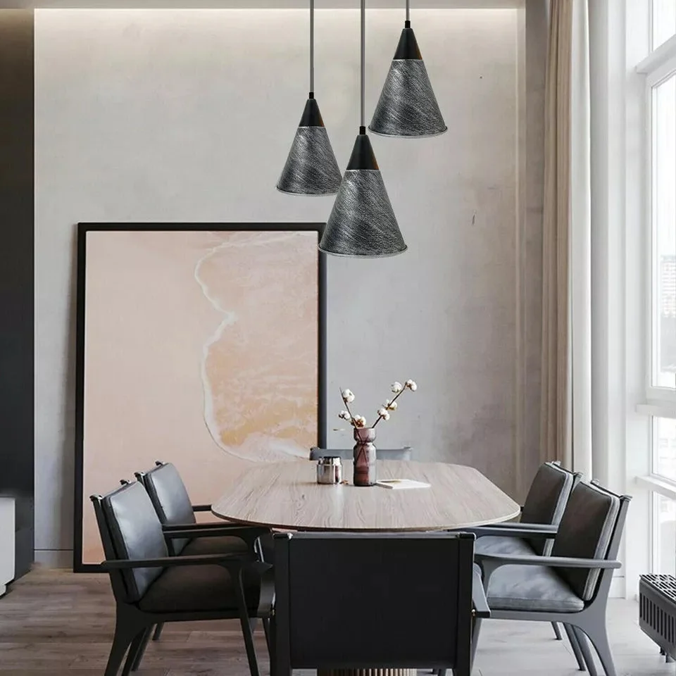 Industrial vintage pendant ceiling light with metal shade in black and brushed copper, hanging from adjustable black wire