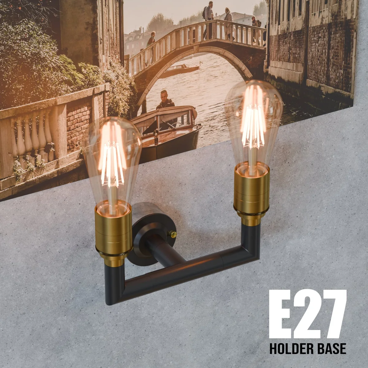 Black industrial wall light with dual E27 fittings mounted on a conduit pipe, showing metal construction and vintage style