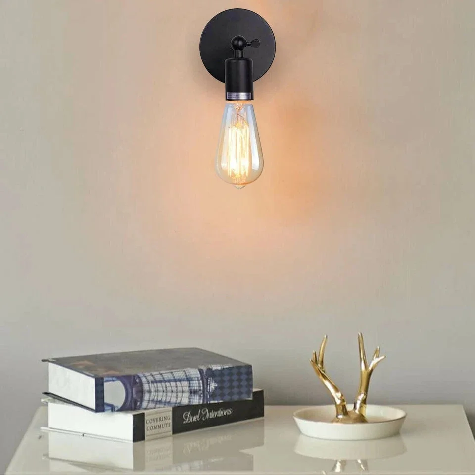 Industrial wall light with adjustable iron metal cage and E27 socket, shown mounted on a rustic wall background