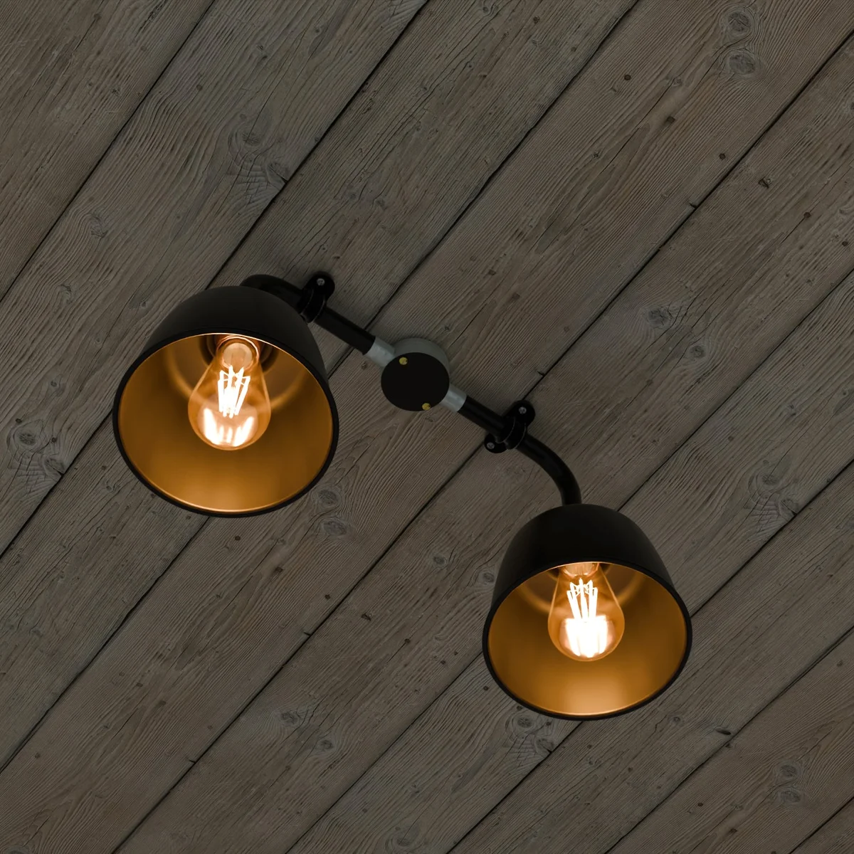 Vintage industrial light with two angled black metal conduit pipes and copper fittings, wall-mounted ceiling fixture