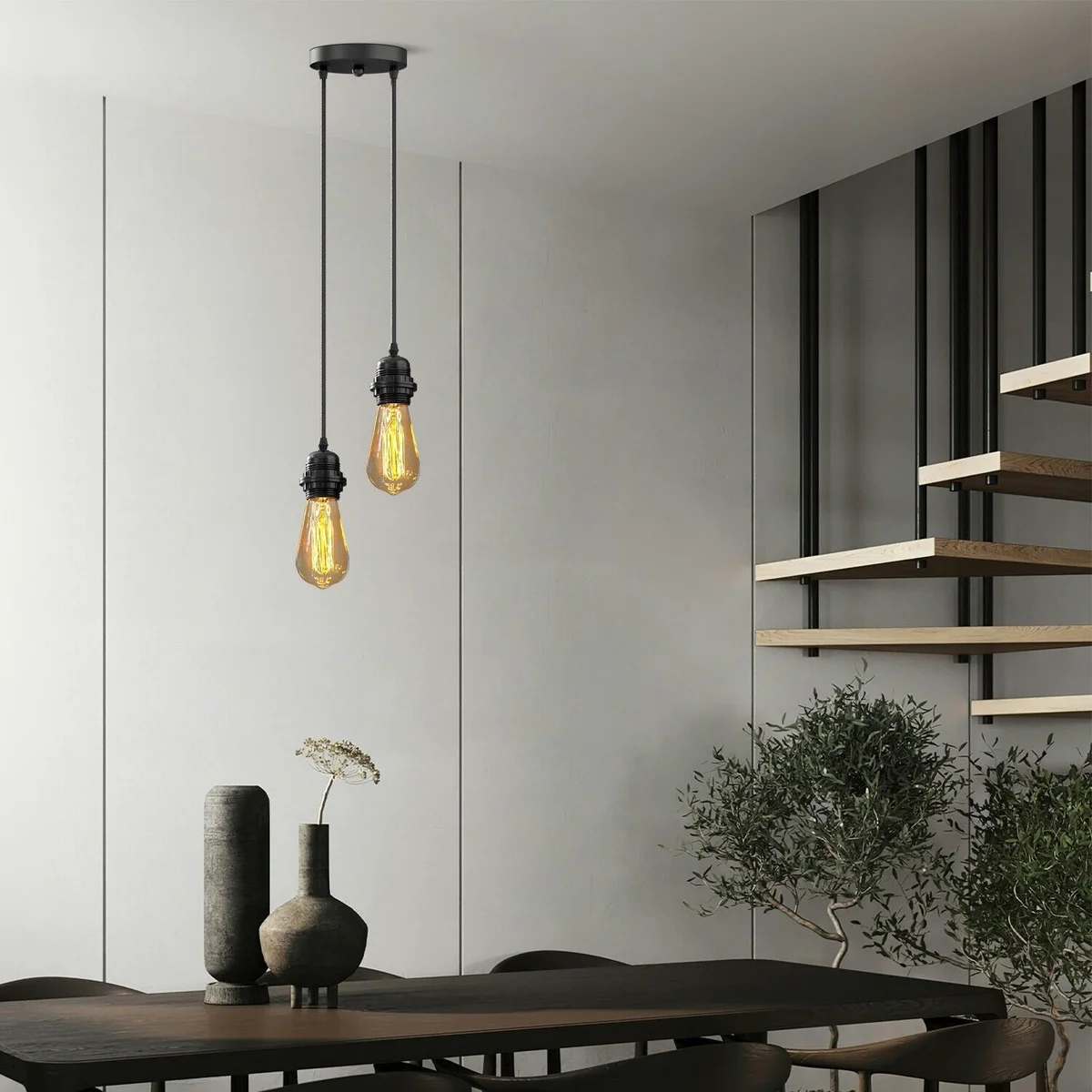 Black dual light ceiling fixture with two adjustable matte black metal pendant lamps and fabric cable hanging from ceiling rose
