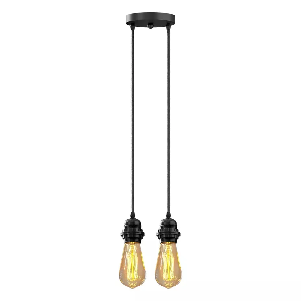 Black twin pendant light with two adjustable matte black metal heads and fabric cable hanging from ceiling rose