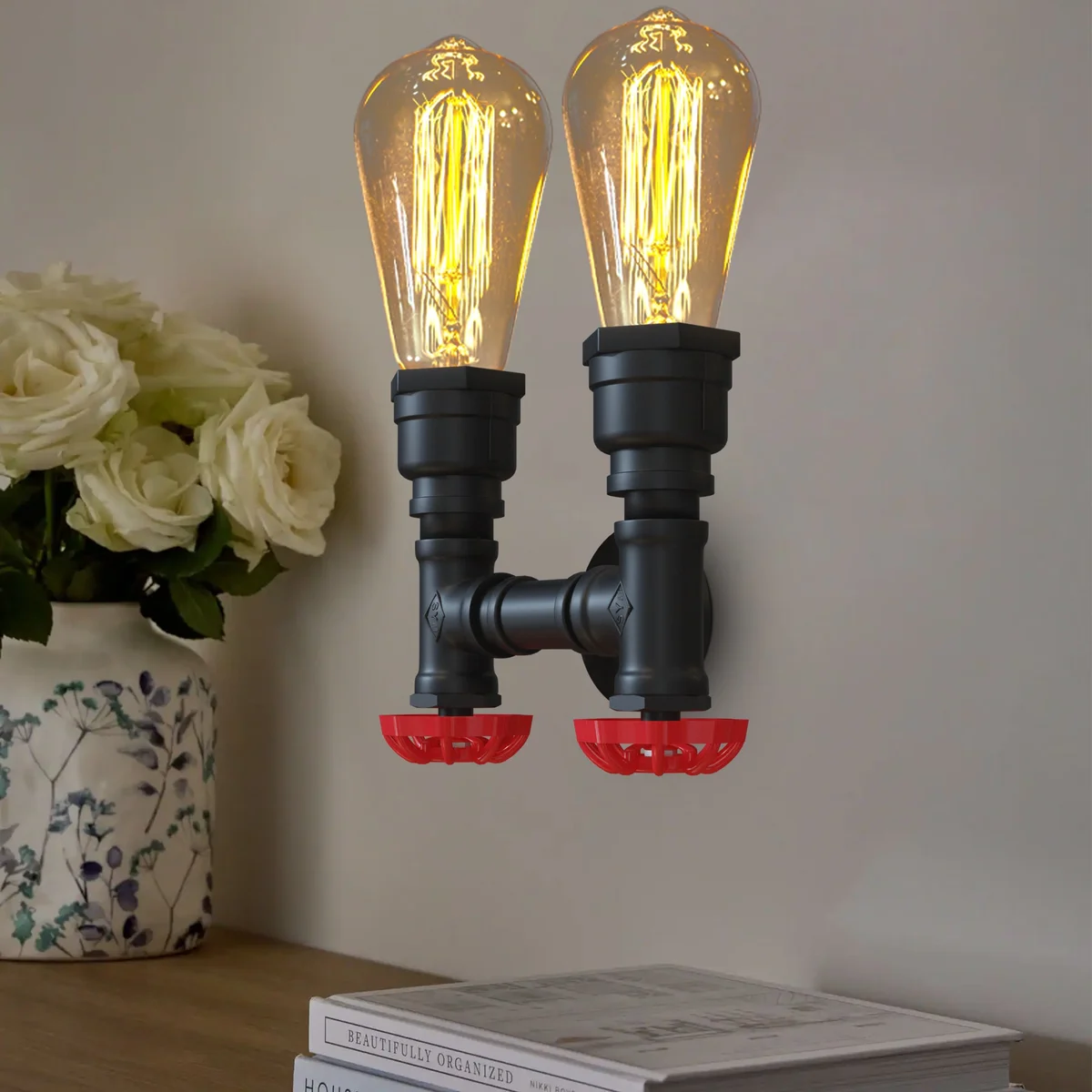 Twin industrial steampunk wall light with dual black metal pipe arms and red valve details, E27 bulb sockets visible
