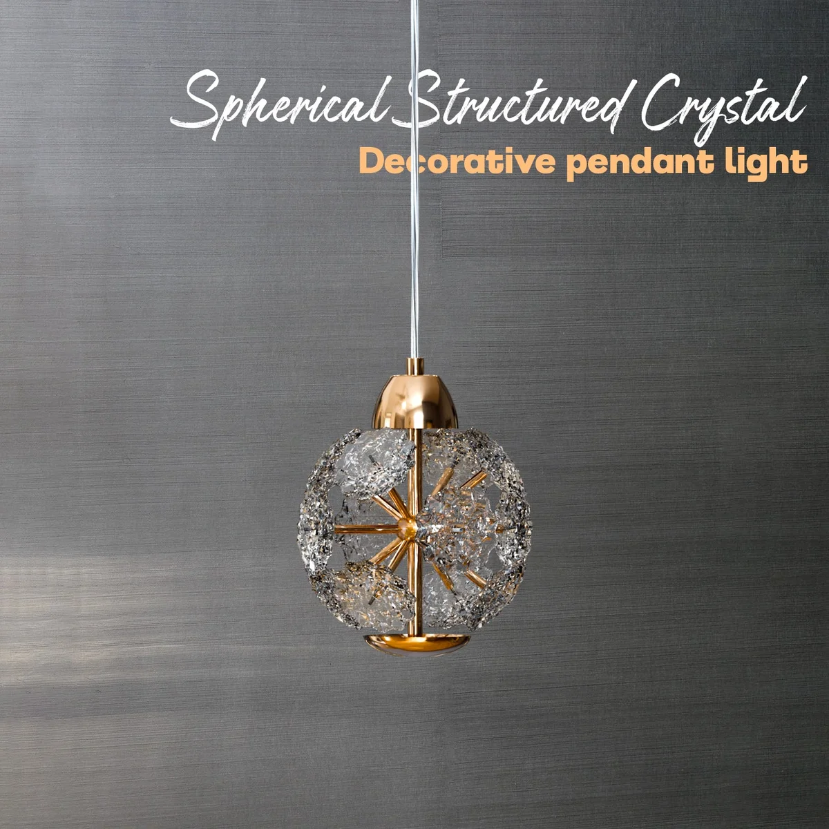 Modern pendant light with round amber crystal glass shade and adjustable cable light hanging from ceiling fixture
