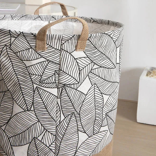 Foldable storage basket made of cotton with waterproof lining, shown folded flat for easy storage and transport