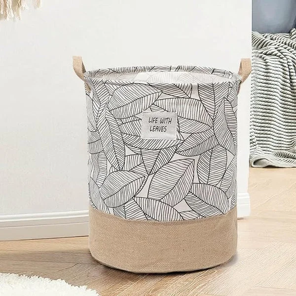 Foldable laundry basket made of cotton with waterproof lining, shown folded flat for easy storage and portability