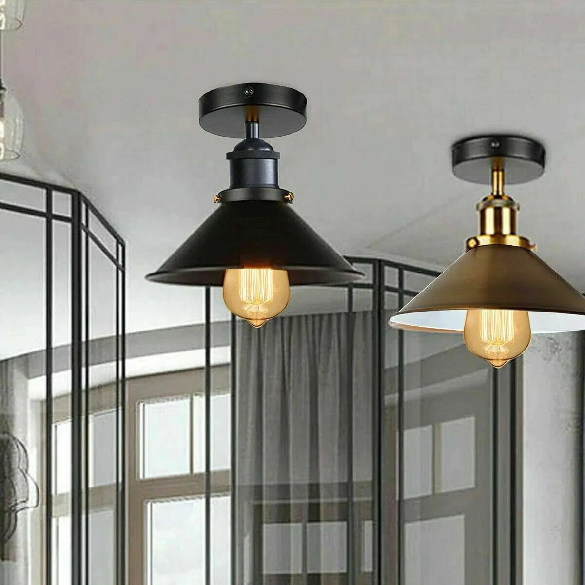 Black metal wall lamp with industrial design, E27 bulb holder, and round ceiling plate for loft or café lighting