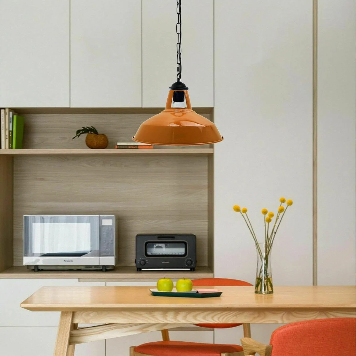 Adjustable pendant lamp with green slotted metal shade, angled hood, and hanging wire and chain for ceiling mounting