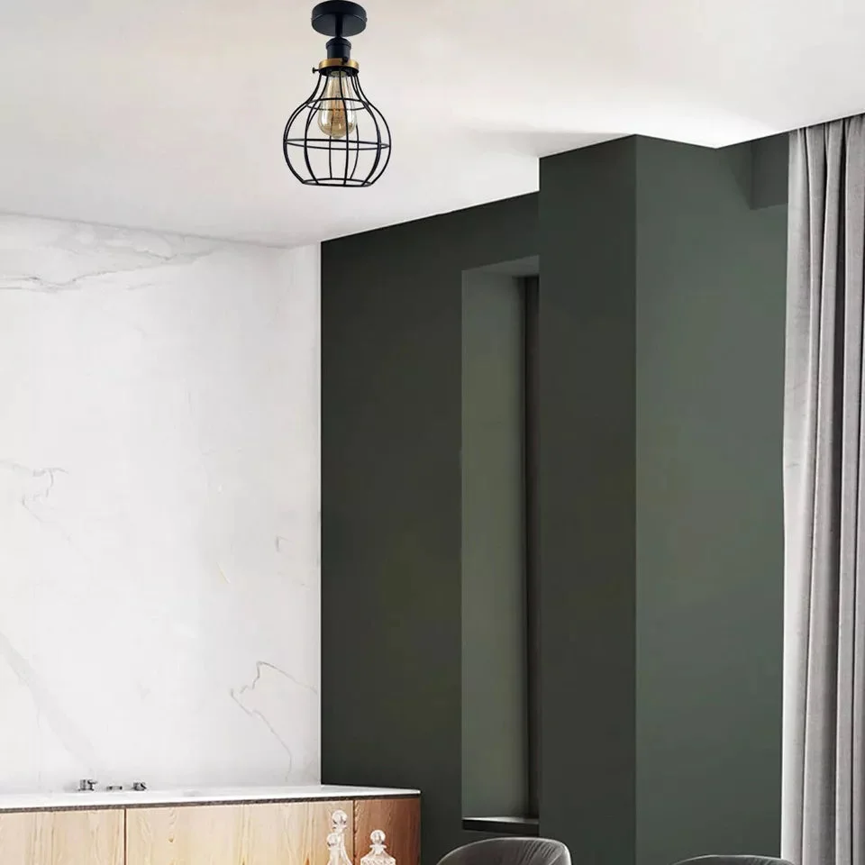 Black metal ceiling light with industrial cage design, flush mount style and E27 bulb holder visible from below angle