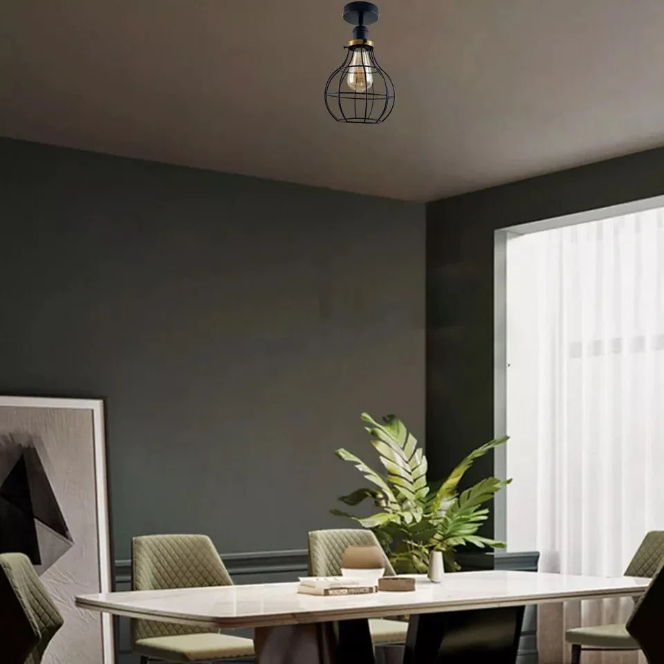 Black metal flush mount ceiling light with cage design, showcasing industrial style lighting for loft spaces