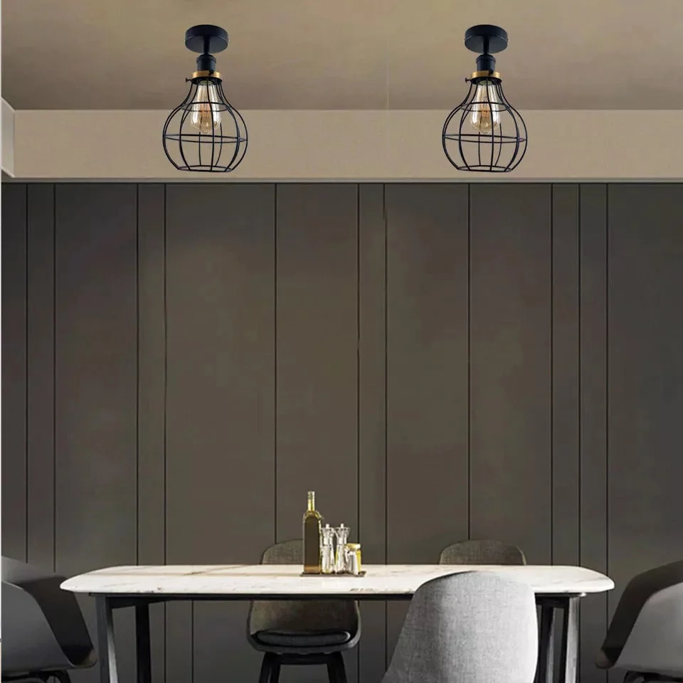 Black metal industrial loft ceiling light with cage design and E27 lamp base flush mounted on ceiling