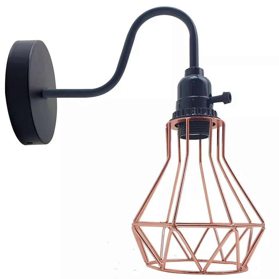 Industrial vintage E27 wall light with geometric metal cage design mounted on a wall in a rustic interior setting