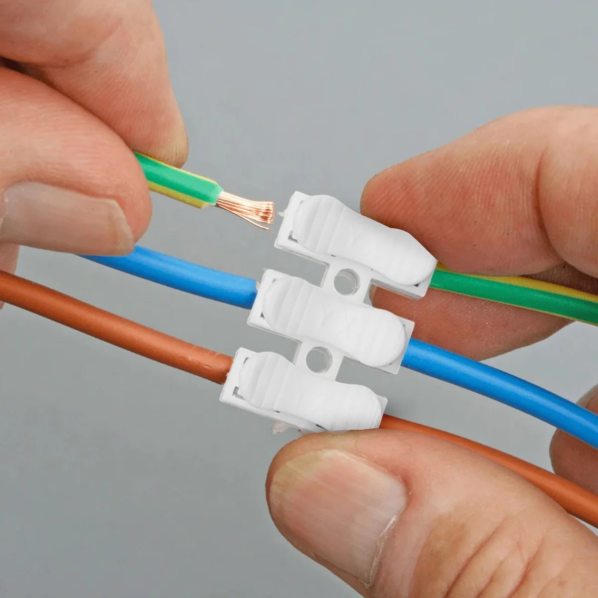 Close-up of flame retardant wire connectors showing self-locking mechanism and quick splice design in red plastic casing