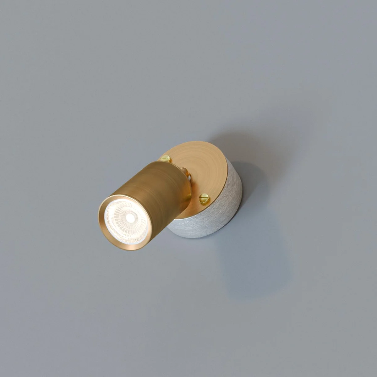 Rotatable wall spotlight in yellow brass with cylindrical metal design and 20mm conduit loop-in box for indoor use
