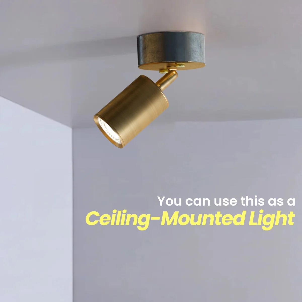 Adjustable wall lamp in yellow brass with cylindrical spotlight and 20mm conduit loop-in box for modern indoor lighting