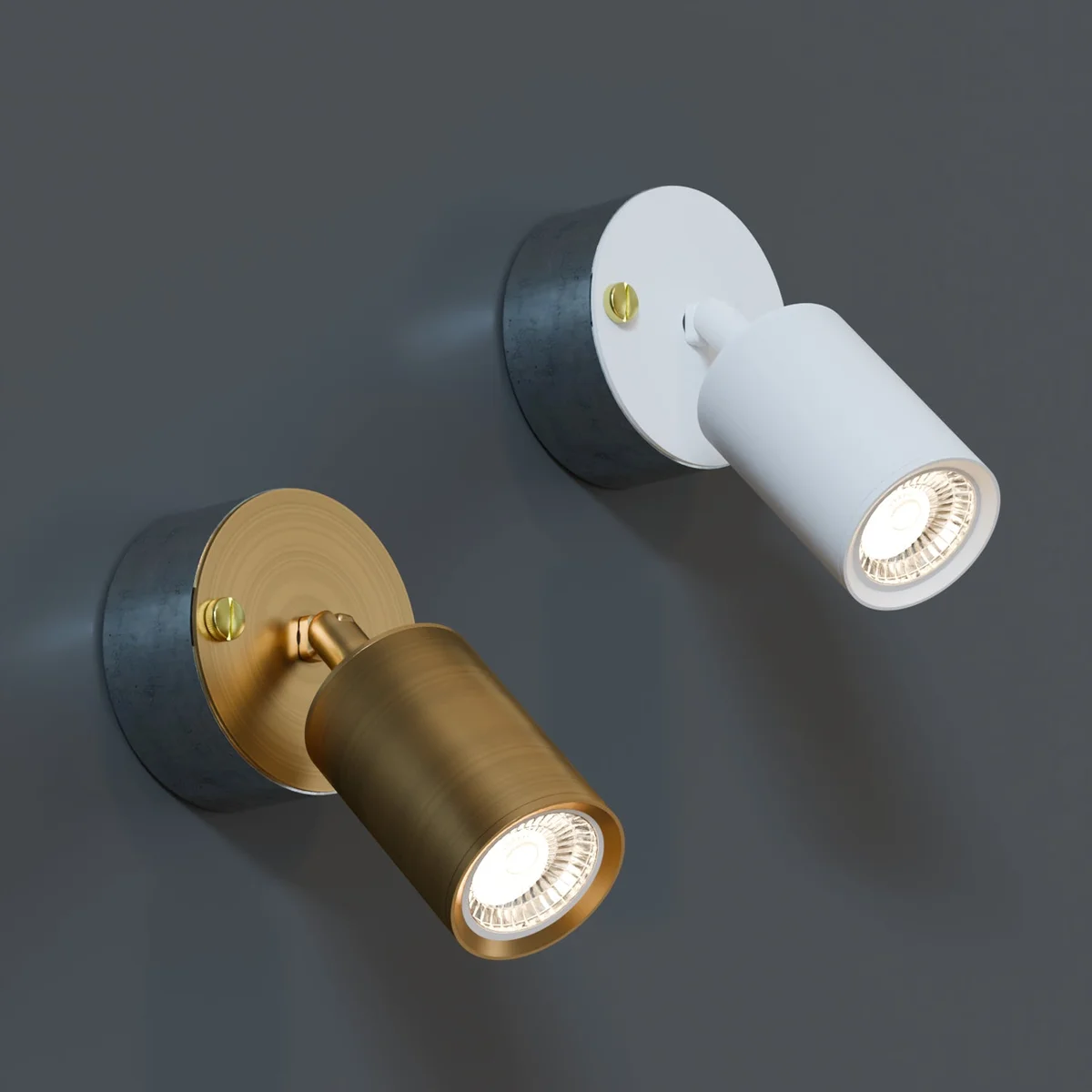 Yellow brass cylindrical indoor spotlight lighting with adjustable arm and galvanized steel conduit loop-in box mounted on wall