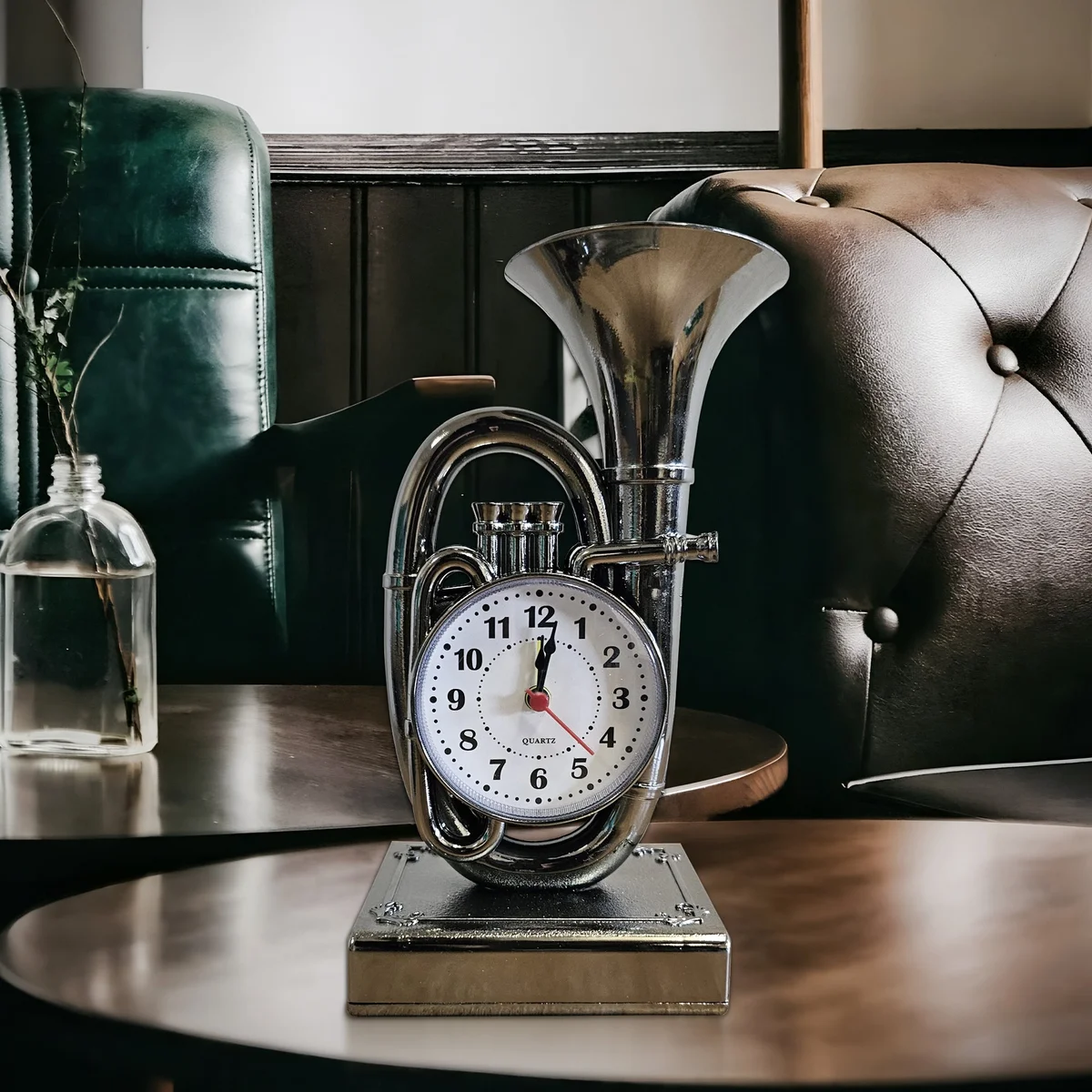 Vintage trumpet alarm clock in chrome with glass front, showing classic analogue dial on a wooden table background