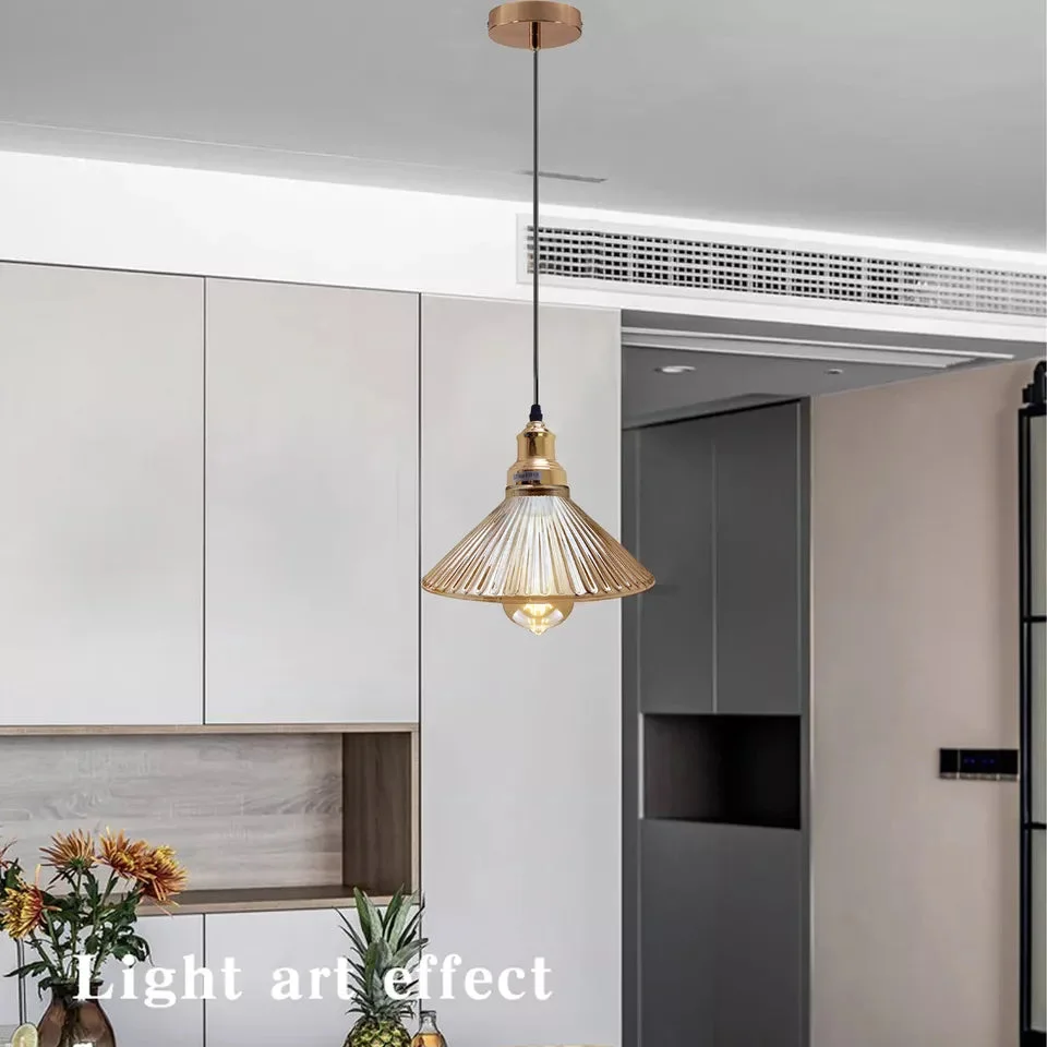 Vintage amber pendant light with adjustable metal fixture and amber glass shade hanging from ceiling cord
