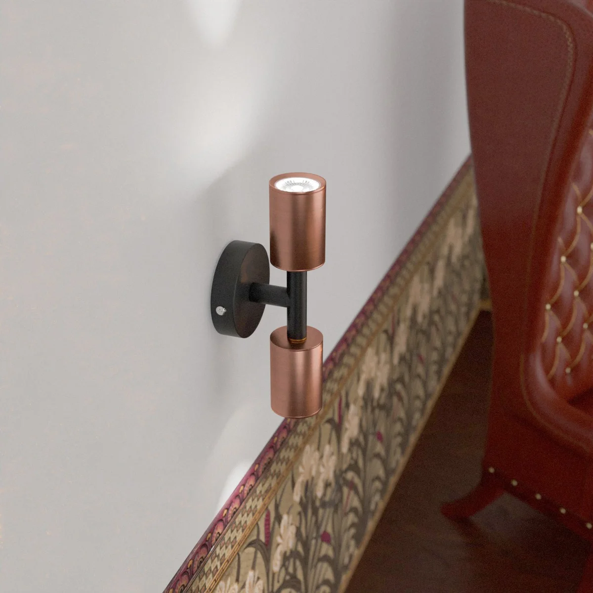 Modern double head wall light with two fixed cylindrical metal heads and GU10 bulbs, sleek conduit design in metal finish