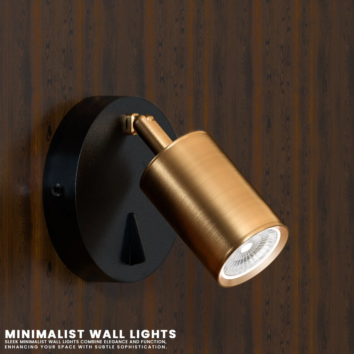 Yellow brass adjustable spotlight lamp with cylindrical head and on-off switch mounted on a white wall