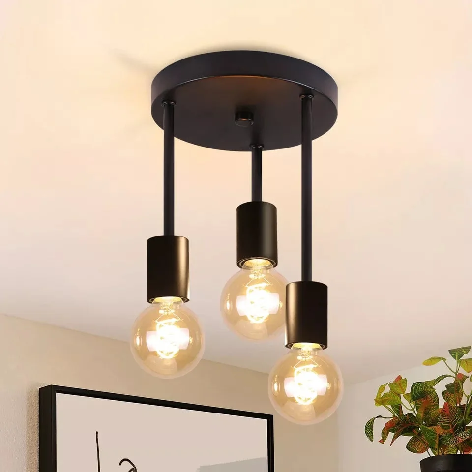 Modern black metal 3-way E27 bulb ceiling light with round base and three pendant fixtures hanging indoors