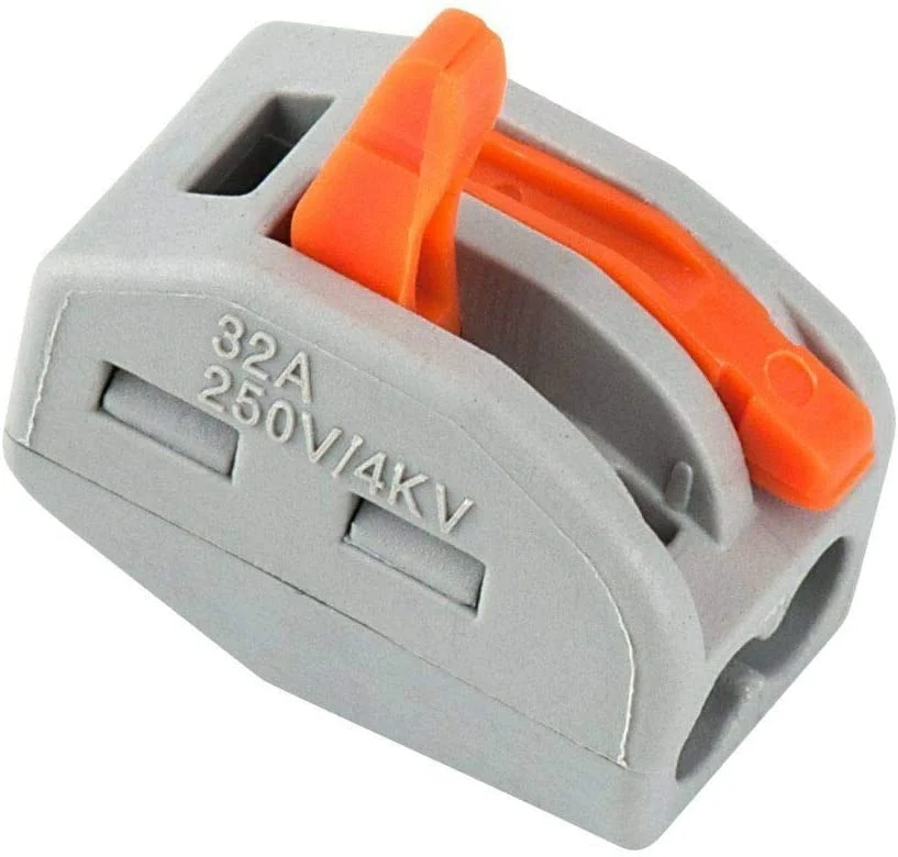 Five orange and clear 5 way wire connectors with spring levers arranged side by side on a white background