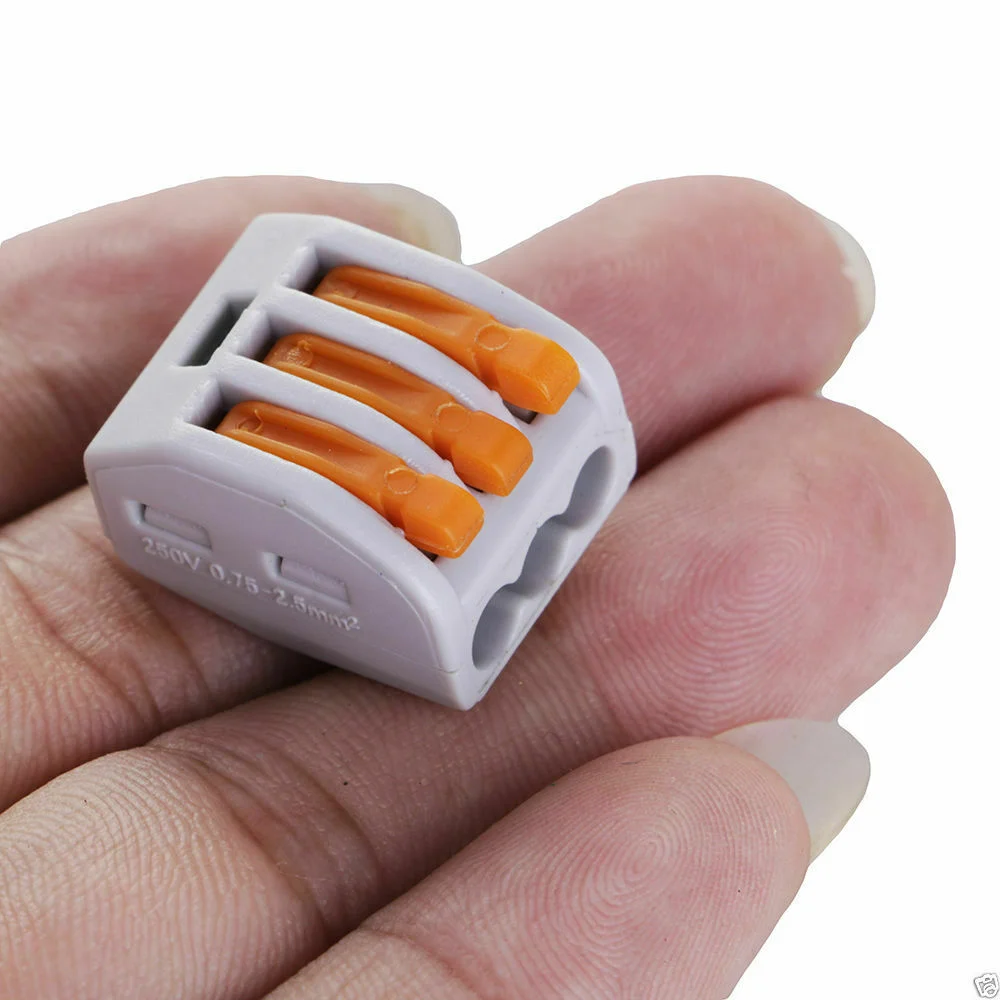 Clear and orange 5 way spring lever wire connectors with levers for secure and reusable electrical connections