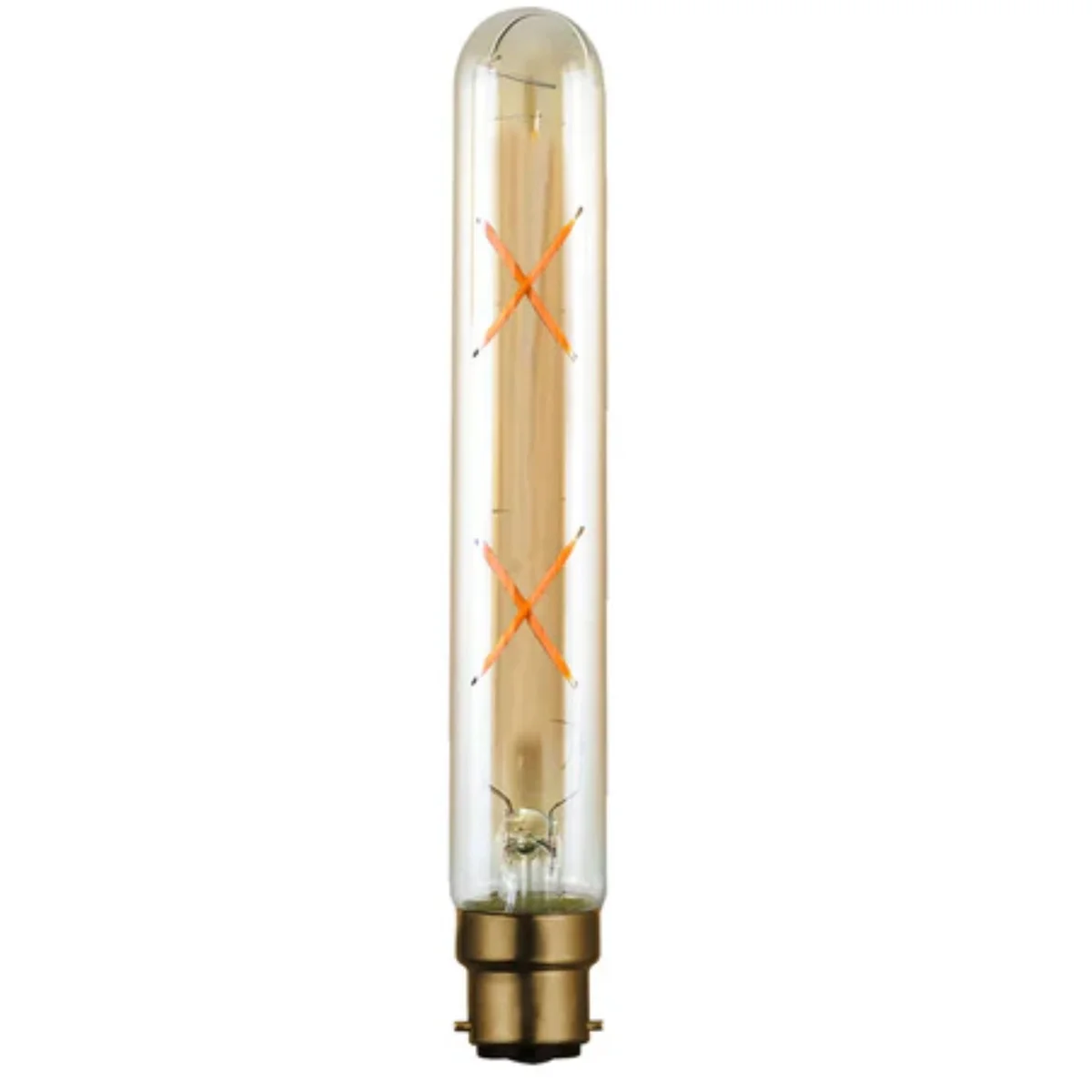 Vintage LED bayonet bulb T185 with B22 base glowing warm white, showing filament design and glass finish