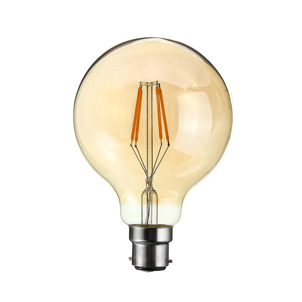 Vintage style G80 amber glass B22 LED lamp with visible filament, glowing warmly against a dark background