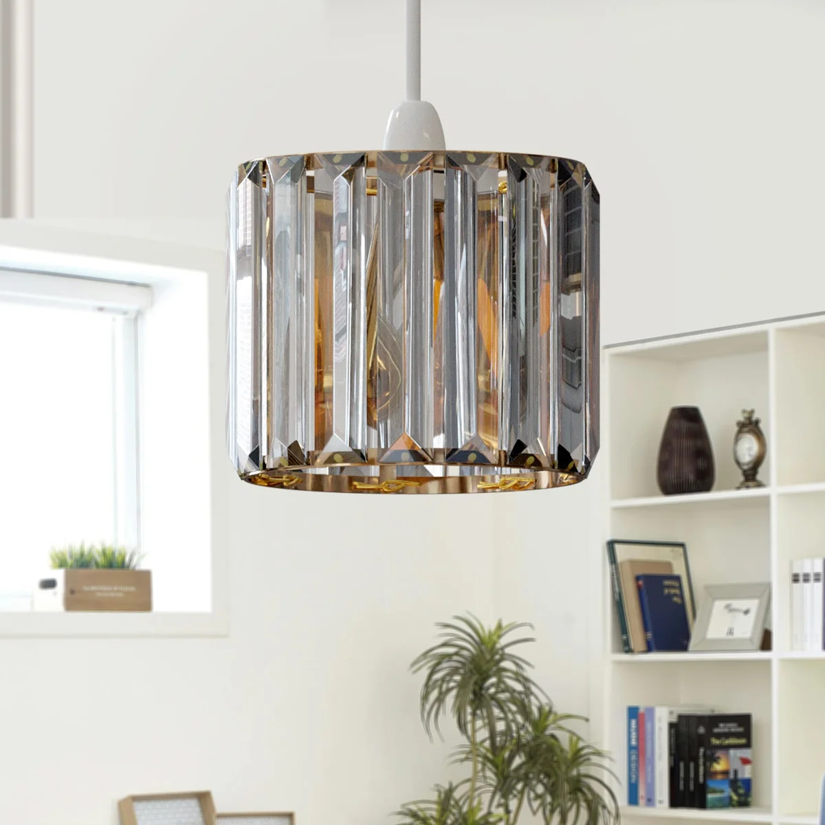 Modern crystal lampshade, drum shape with chrome, crystal glass reflecting light, fitted to an E27 socket.
