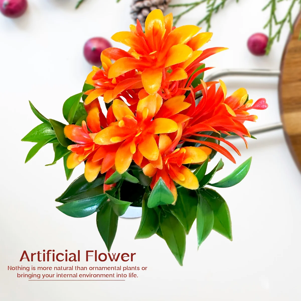 Bright artificial flowers with lush green leaves in a small plastic flower pot, perfect for indoor decoration