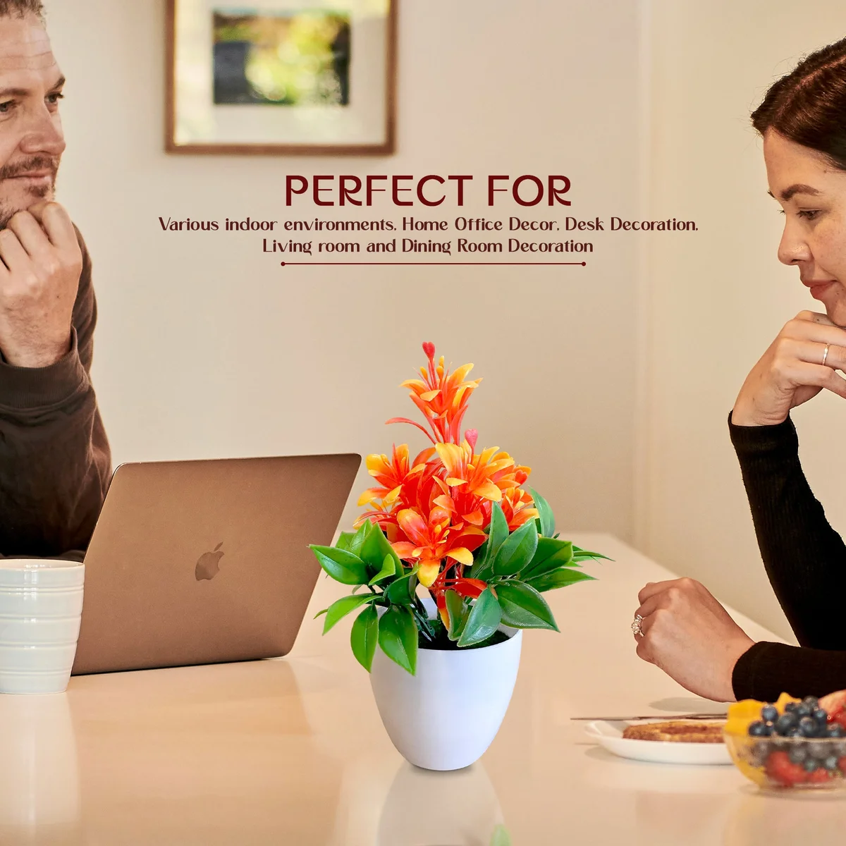 Small plastic pot with vibrant artificial flower plants featuring bright colours and lush green leaves for indoor decor