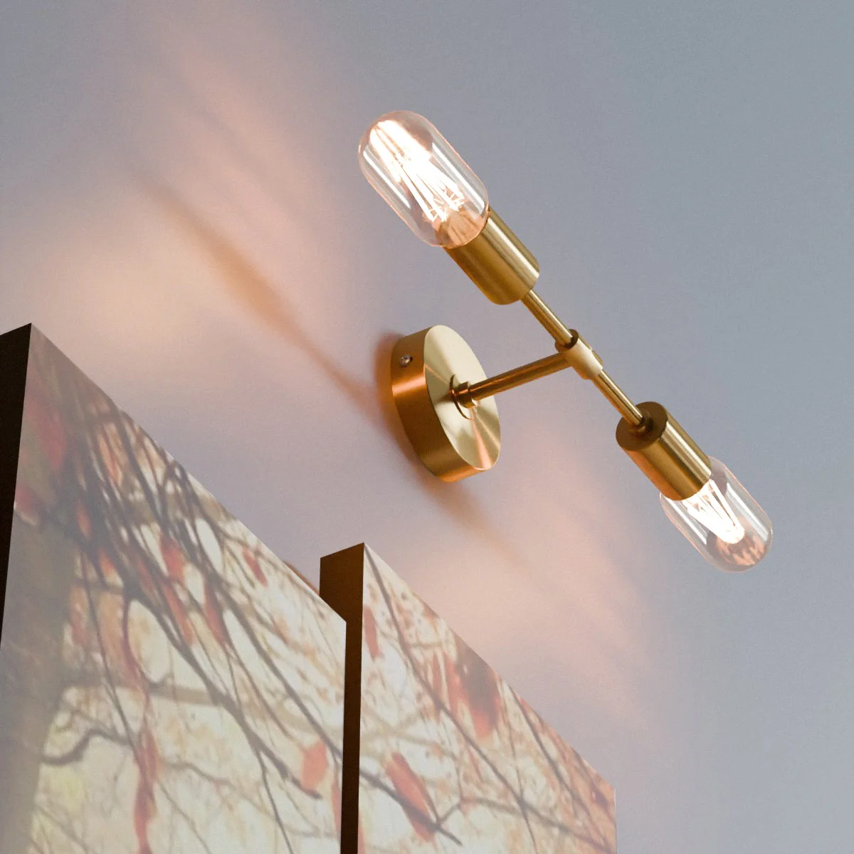 Dual socket ceiling light in polished rose gold finish mounted on white wall, showing two E27 bulb sockets and metal frame