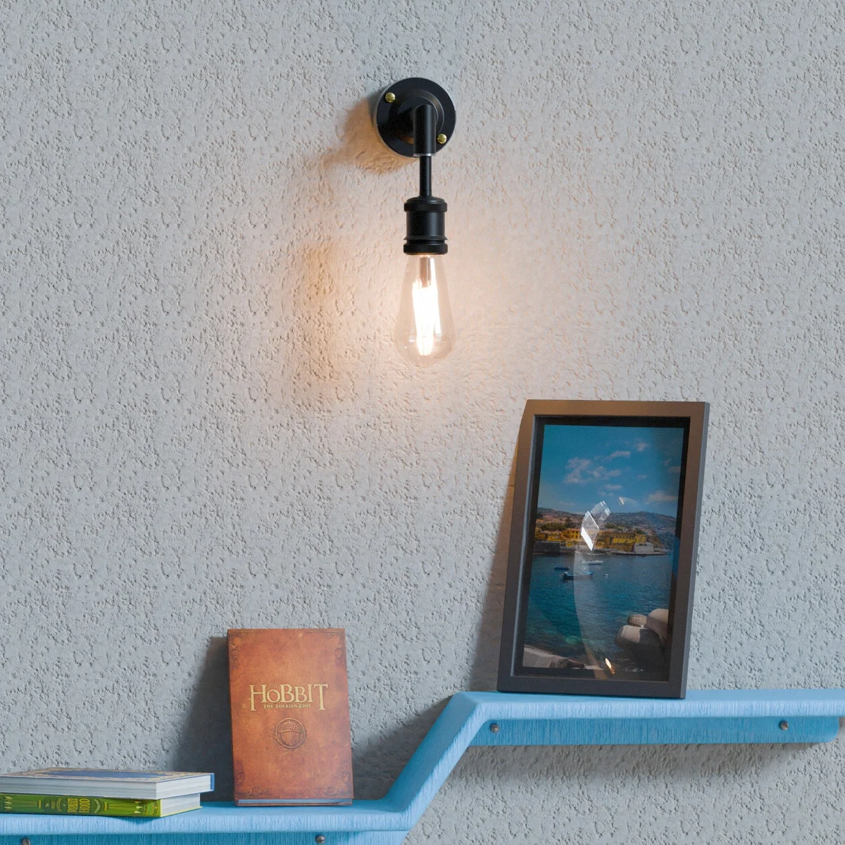 Black metal conduit lamp wall light with sharp elbow design and E27 bulb holder mounted on white wall