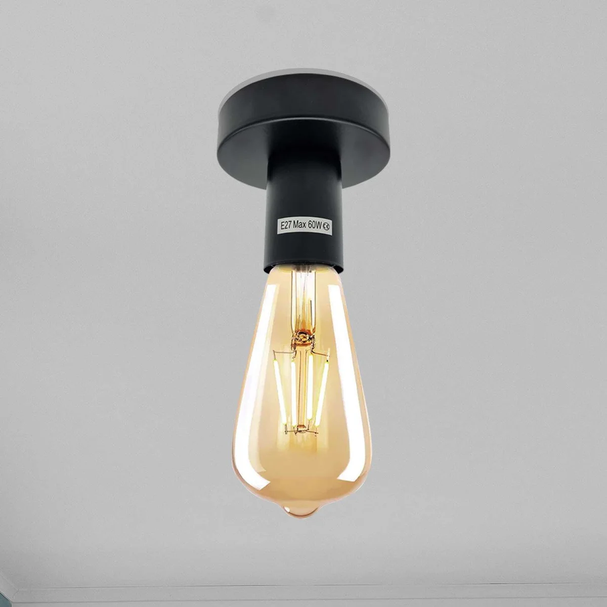 Vintage industrial ceiling light holder in metal with flush mount design and E27 fitting against white background