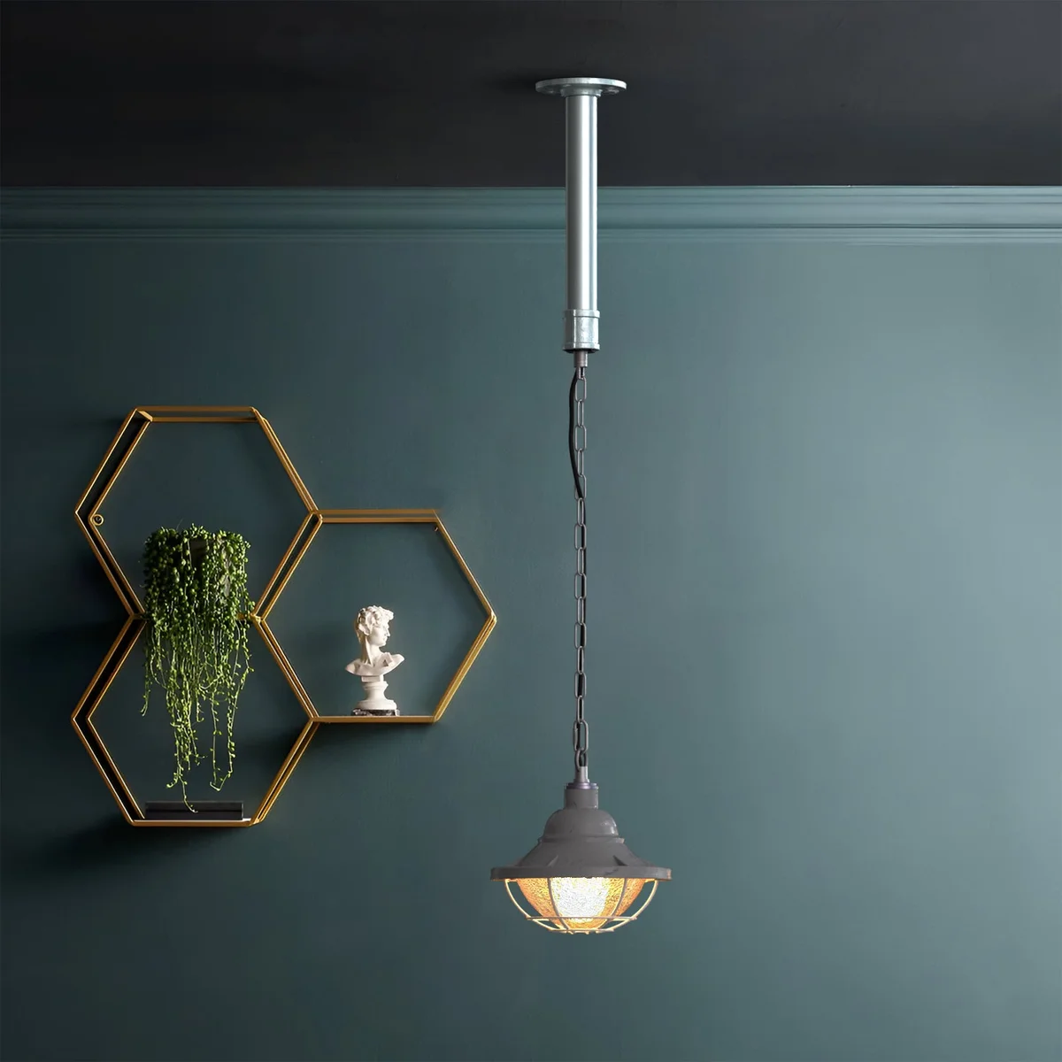 Industrial metal wire cage pipe pendant light with polished finish, ideal for urban loft lighting and rustic decor