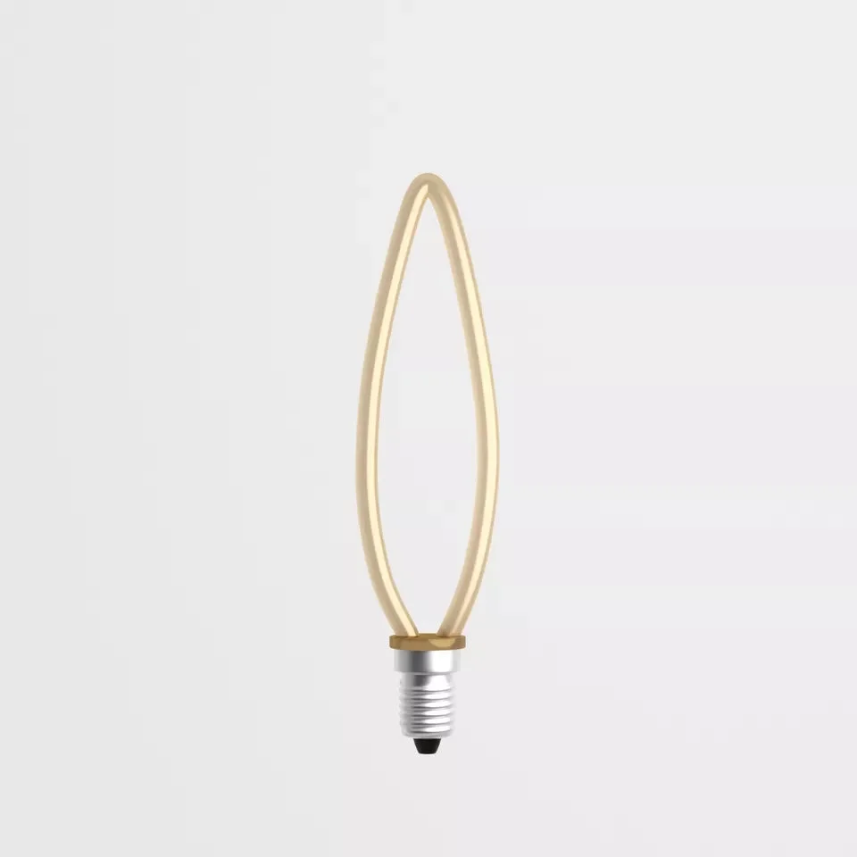 Vintage LED light bulb with Edison screw fitting glowing warm yellow light on a dark background