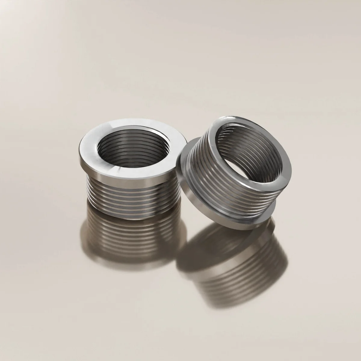 Metal thread reducer showing 20mm female to 3/4 inch male threads in durable metal pipe fitting converter