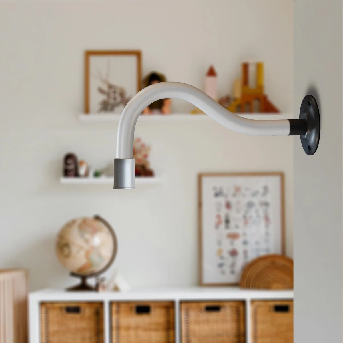 Flexible LED wall light with curved metal gooseneck arm mounted on a white wall, showing cool white illumination
