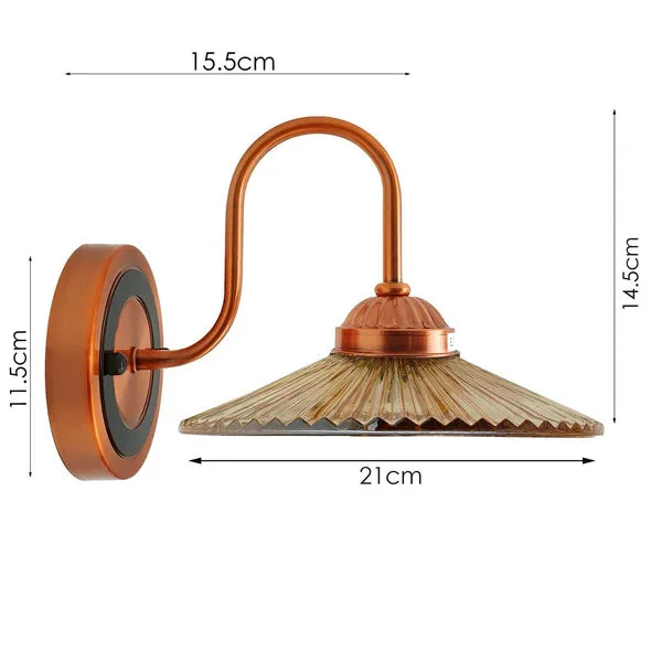 Industrial antique amber indoor wall light fixture with metal cage shade mounted on a white wall background