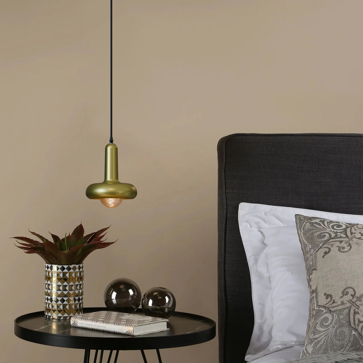 Modern pendant light with black mushroom-shaped metal shade and adjustable PVC cable hanging from ceiling