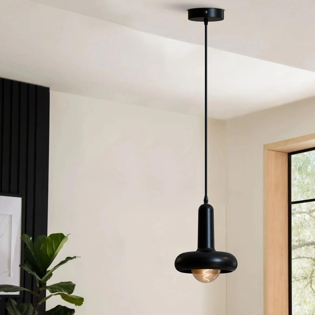 Modern black pendant lamp with rounded mushroom-shaped metal shade and adjustable 95cm cable hanging from ceiling