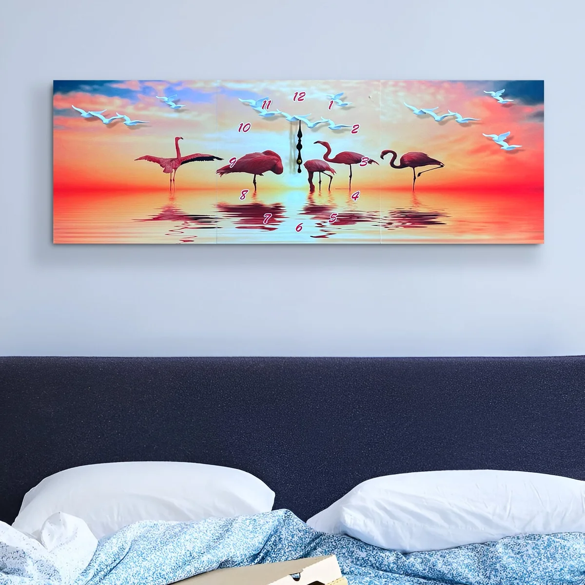 Three-panel modern flamingo wall clock with pink flamingos and tropical leaves on a large canvas display