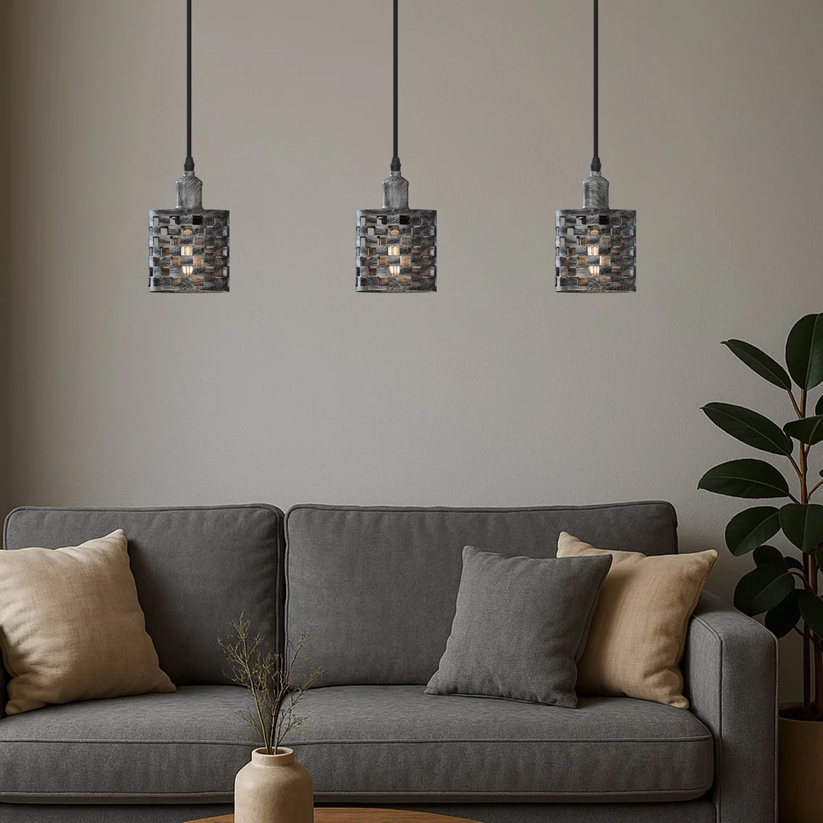 Vintage ceiling light with three black metal barrel cage shades hanging from adjustable cables and chains
