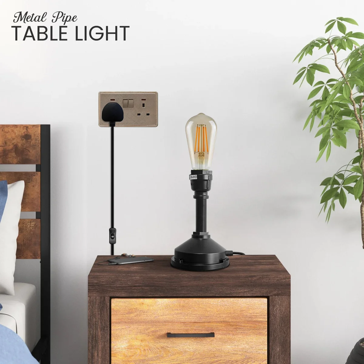 Steampunk table lamp with vintage industrial water pipe design, black metal finish, and inline on/off switch on plug cable