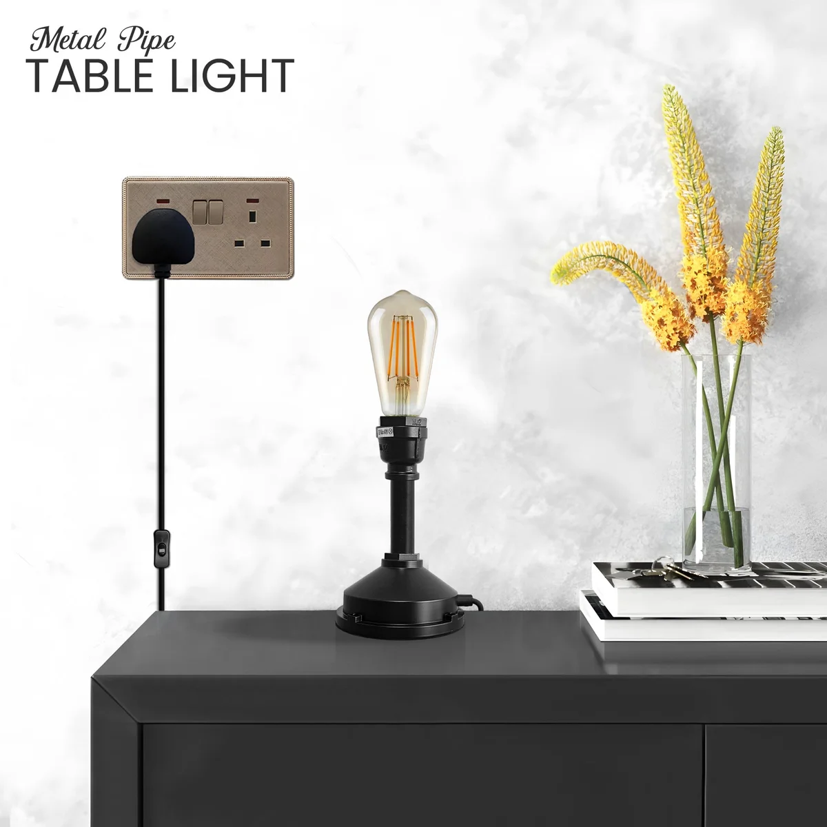 Steampunk table lamp with vintage industrial water pipe design in brushed copper finish on wooden surface