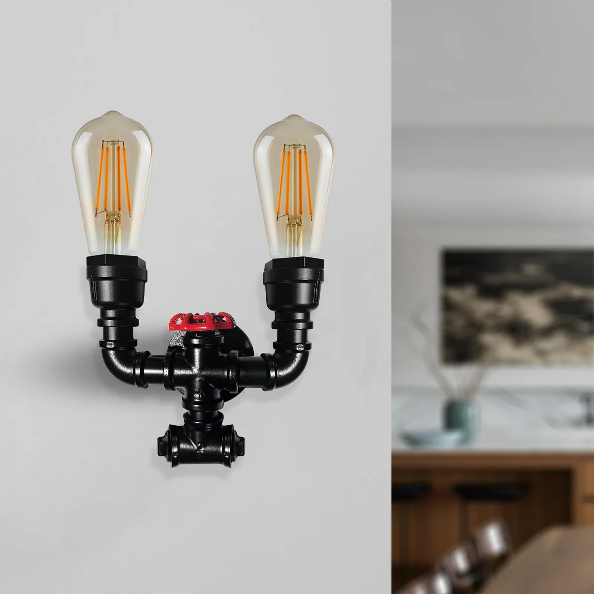 Industrial wall light with twin iron pipe arms, black frame, red valve detail, vintage steampunk style.