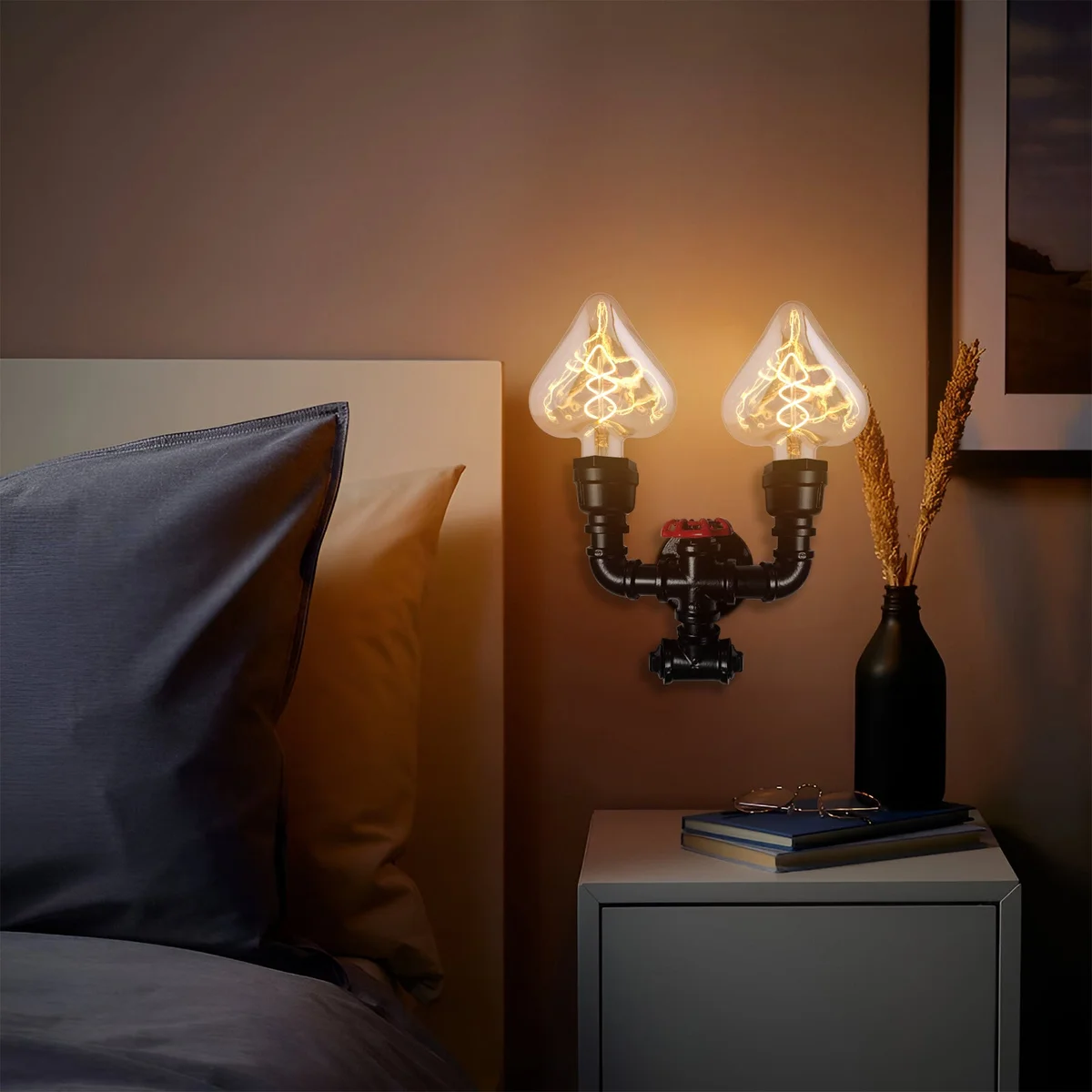 Twin pipe wall lamp with black metal frame and red valve detail, featuring dual iron pipe arms.