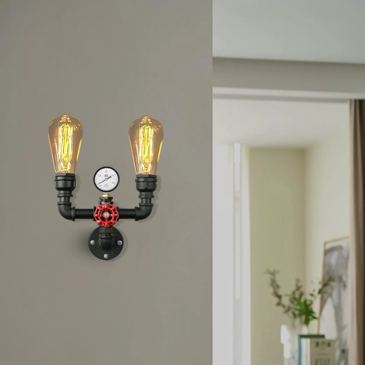 Vintage industrial metal wall sconce with twin water pipe arms, red valve detail, and brushed copper finish mounted on wall
