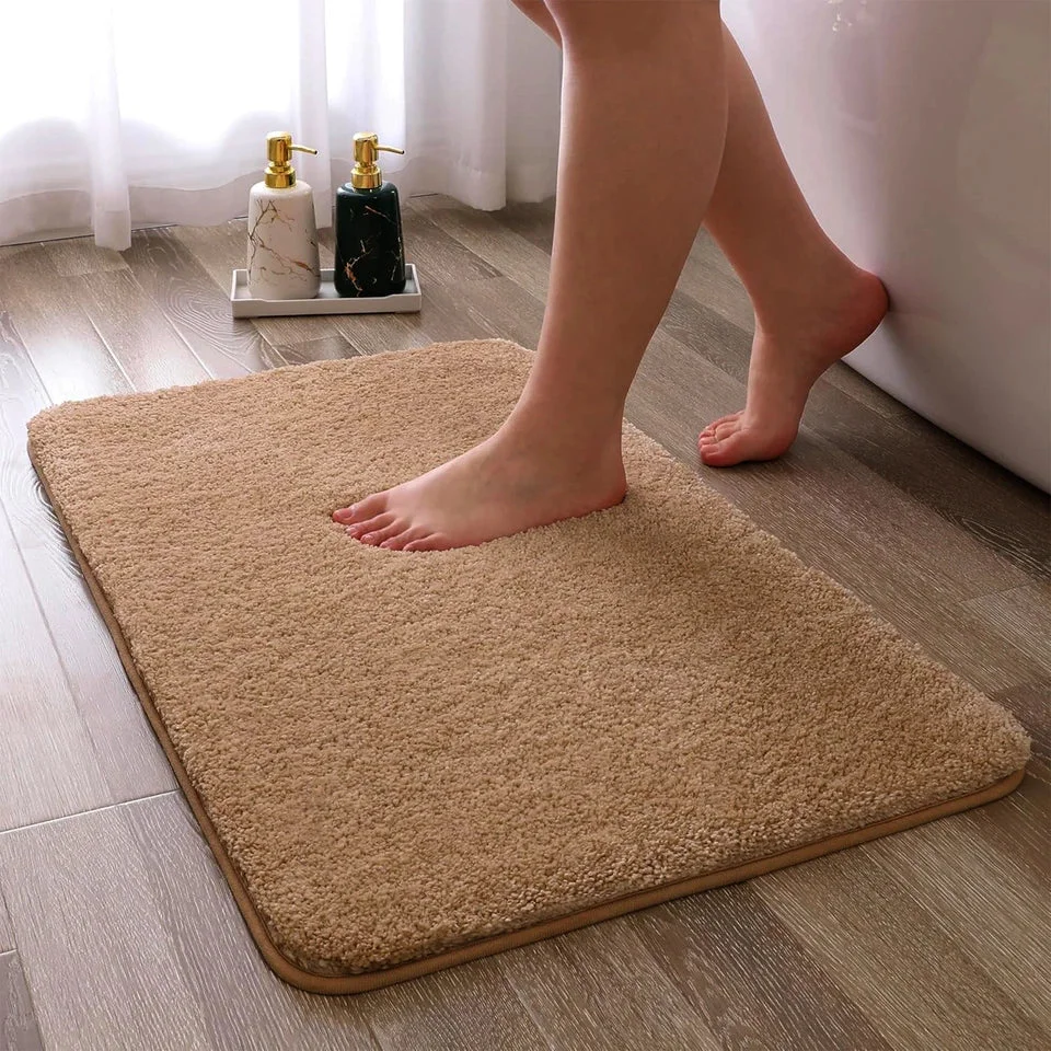 Rectangular 80x50cm ultra-soft grey microfiber doormat with fluffy texture and anti-slip backing on wooden floor
